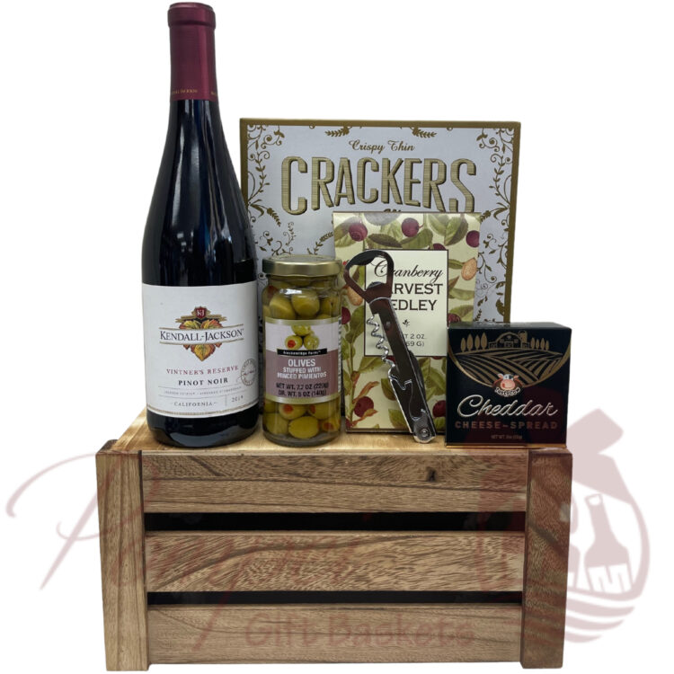 Kendall Jackson red wine in a rustic draw with savory snacks