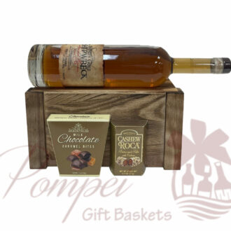 Brinley Gold Shipwreck Spiced Rum in a faux wooden book with chocolates